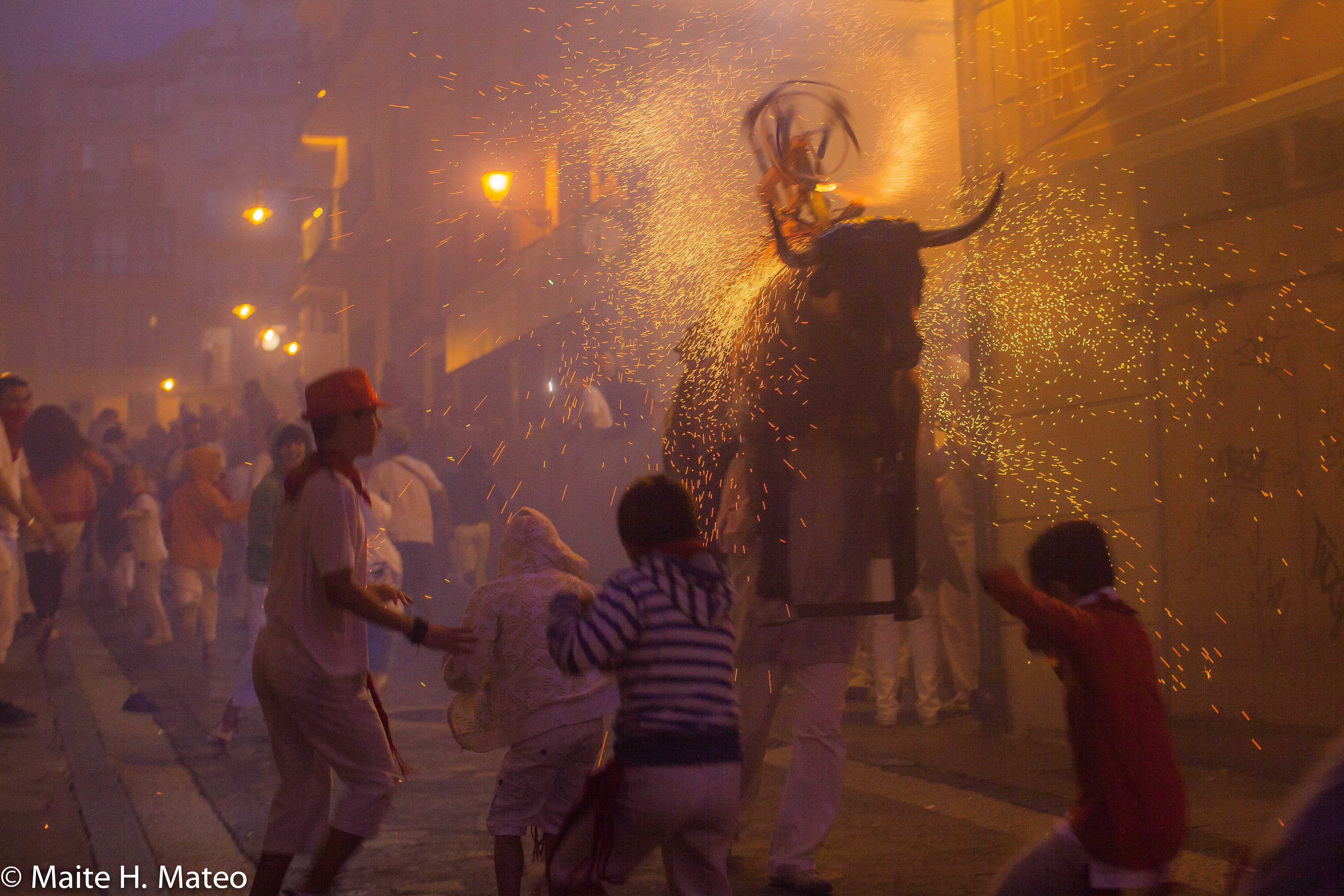 Activity for families during San Fermín at night. The fire bull.